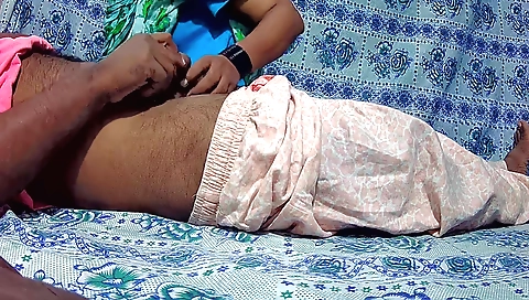Two young boys are getting on top of one another on the floor