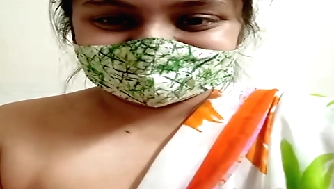 Indian woman fingers her pussy in solo webcam video