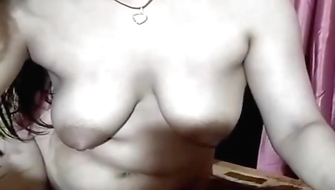 Indian brunette in a webcam video cum with a facial