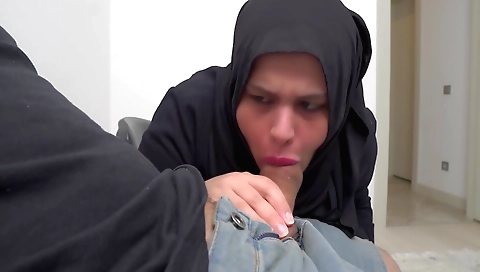 Amateur blonde in a hijab is flashing her tight pussy