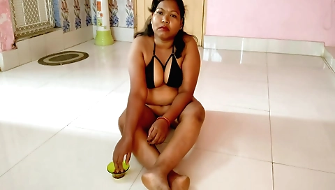 Cute housewife is doing a solo action in her house