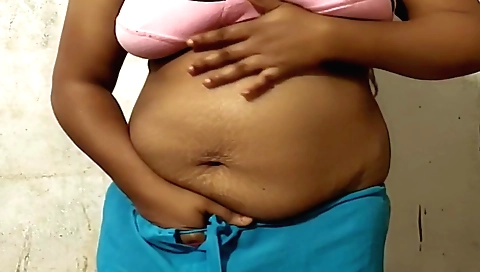 Busty indian aunty in a swimsuit and bra in stockings