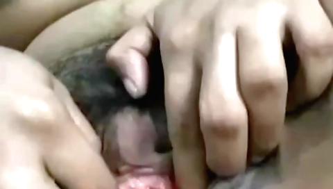 Busty brunette plays with hairy pussy in solo masturbation video