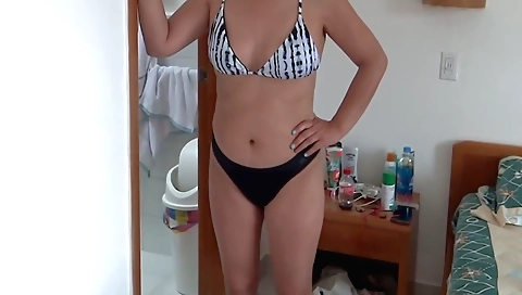 Beautiful brunette naked on the beach in sexy pose