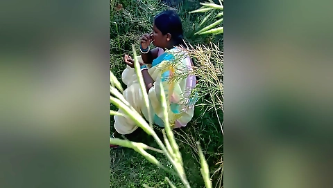 Indian brunette with a sexy ass showing it on a rock