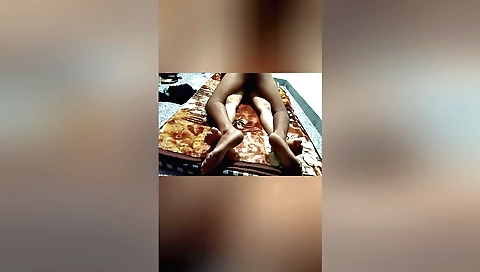 Indian teen tourist rides a motorcycle on the highway