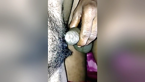Indian girl has a sexy face and shows off her hairy pussy