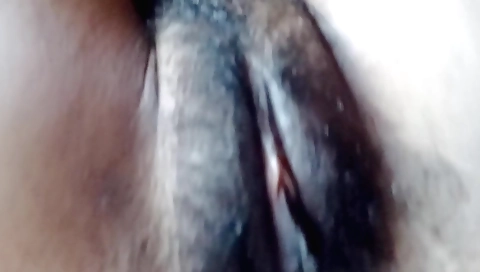A hairy slut with a hairy pussy is having sex in bed