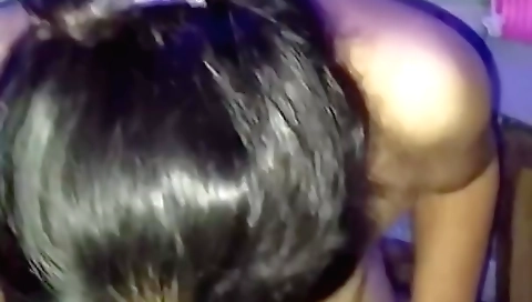 Indian girl with tattooed face shows a closeup facial