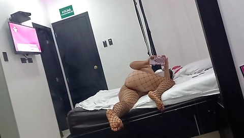 Naked brunette with a huge body masturbating on bed
