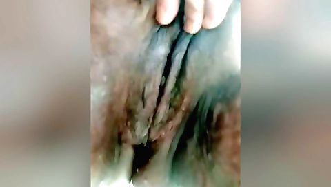 A beautiful milf fingering herself after a solo sex