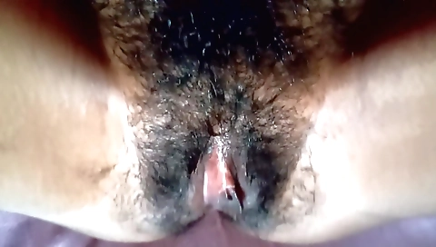 Indian hairy female with a nice body sucks a vibrator