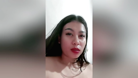 Indian brunette shows her sexy face in her bedroom