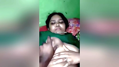 Indian bhabhi in a sexy outfit playing with a dildo
