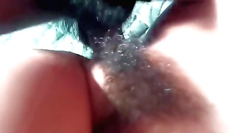 Indian girl with hairy pussy plays with a toy in a hot scene