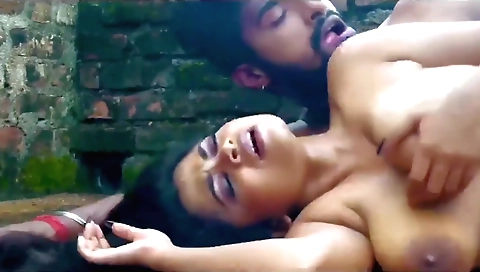 A sexy brunette hot brunette with big tits gets outdoors