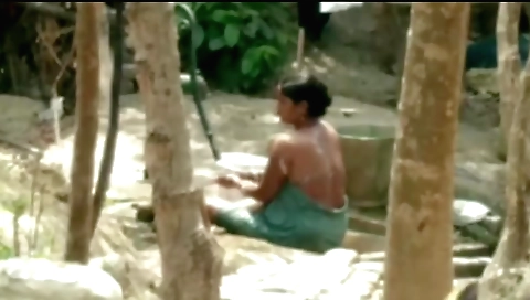 Indian babe in red bikini plays with her pussy outdoors
