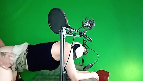 Indian woman rides in her car in front of green screen