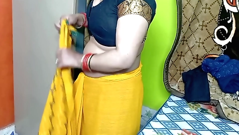 Indian beauties in yellow color sari with a beautiful body